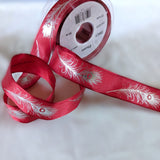 Red wire edge taffeta ribbon with a metallic silver feather print. 2.5cm wide, UK made by Berisfords Ribbons. Buy online & cut to length by the metre with discounts on 10 metres & full reels.