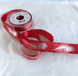 Red wire edge taffeta ribbon with a metallic silver feather print. 2.5cm wide, UK made by Berisfords Ribbons. Buy online & cut to length by the metre with discounts on 10 metres & full reels.