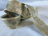 R2748 40mm Metallic Gold Tinsel Centre Ribbon with a Green Background
