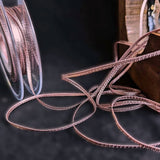 3mm wide textured metallic rose gold pink ribbon. Berisfords Ribbons.