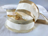 Cream polyester taffeta ribbon with metallic gold borders and wire edged. 40mm wide, made in the UK by Berisfords Ribbon. buy by the metre and cut to length.