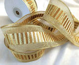Gold mesh ribbon with a metallic lurex and old gold brown banded centre. 40mm wide, double face and wire edge. Buy online per metre Ribbonmoon ribbons UK online shop.