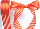 40mm orange satin‑sheer ribbon with pale gold metallic stripes and wired edge