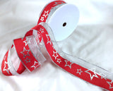 Christmas ribbon clearance sale. 10 metre length. Red polyester with a metallic silver mesh element and Christmas star print. 4cm wide