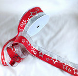 Christmas ribbon clearance sale. 10 metre length. Red polyester with a metallic silver mesh element and Christmas star print. 4cm wide