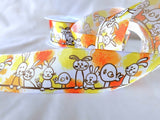 40mm wired edge taffeta ribbon with an Easter theme print of bunny rabbits and chicks.