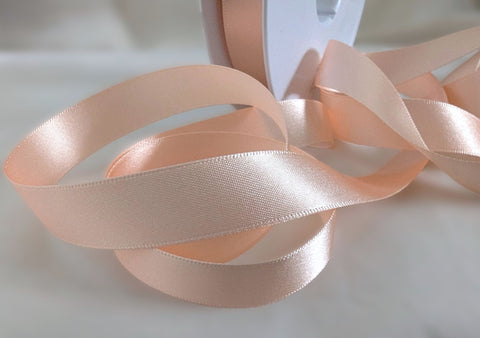 7mm width peach double face satin ribbon. sold by the metre or big discounts for longer lengths and full rolls. Ribbonmoon sewing supplies uk