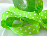 Fluorescent green grosgrain ribbon with a white polka dot design. 25mm wide, sold per metre.
