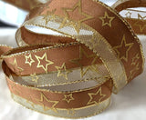 Brown and metallic gold mesh ribbon with wired borders and a gold star  print. 1"-inch width.