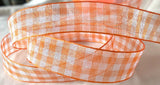 Orange and white sheer nylon traditional gingham ribbon. 15mm width.