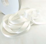 Berisfords bridal white satin ribbon. 10mm width, double face, polyester. Buy by the metre and cut to the length you require. Ribbonmoon ribbons online shop.
