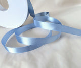 10mm width satin ribbon by Berisfords Ribbons in the UK.  Sold by the metre with discounts for longer lengths and full rolls. Dusky blue colour 61.