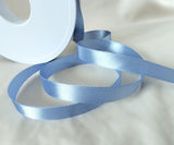 10mm width satin ribbon by Berisfords Ribbons in the UK.  Sold by the metre with discounts for longer lengths and full rolls. Dusky blue colour 61.