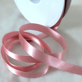 10mm width satin ribbon by Berisfords Ribbons in the UK.  Sold by the metre with discounts for longer lengths and full rolls. Dusky pink, colour 60.