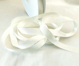 Berisfords bridal white satin ribbon. 7mm width, double face, polyester. Buy by the metre and cut to the length you require. Ribbonmoon ribbons online shop.