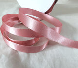 7mm width satin ribbon by Berisfords Ribbons in the UK.  Sold by the metre with discounts for longer lengths and full rolls. Dusky pink, colour 60.