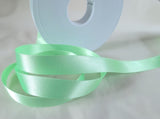 7mm wide mint green double face satin ribbon by berisfords ribbons uk. colour 56. Buy online by the metre or full rolls. Ribbonmoon haberdashery