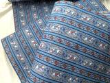vintage cotton material with a rocking horse and fruit basket design