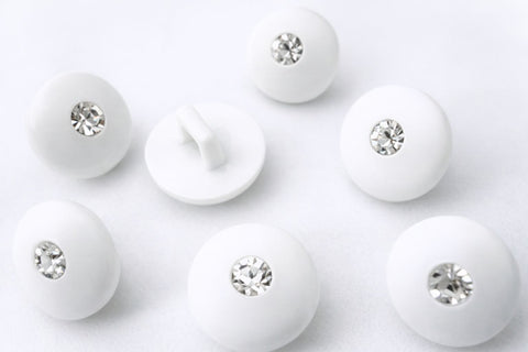 11mm white glossy domed shank button with diamante centre jewel.