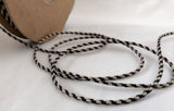 2mm wide black and beige rustic twine. Made in the UK by Berisfords Ribbons