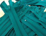 Closed end zips. 15cm long, no.3 size nylon centre fastening and jade green polyester fabric.