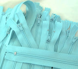 Closed end zips. 18cm long, no.3 size nylon centre fastening and turquoise polyester fabric.