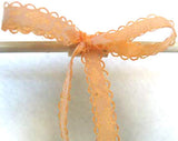 R4447 12mm Pale Orange Acetate Ribbon over a White Lace - Ribbonmoon
