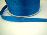 R7027 10mm Dark Royal Blue Satin Ribbon with a Subtle Jacquard Rose Tonal Design