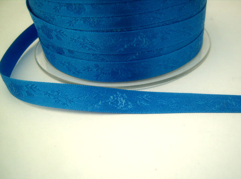 R7027 10mm Dark Royal Blue Satin Ribbon with a Subtle Jacquard Rose Tonal Design