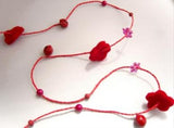 R7083 Red Beads and Felt Shapes on a Rustic Twised Cord